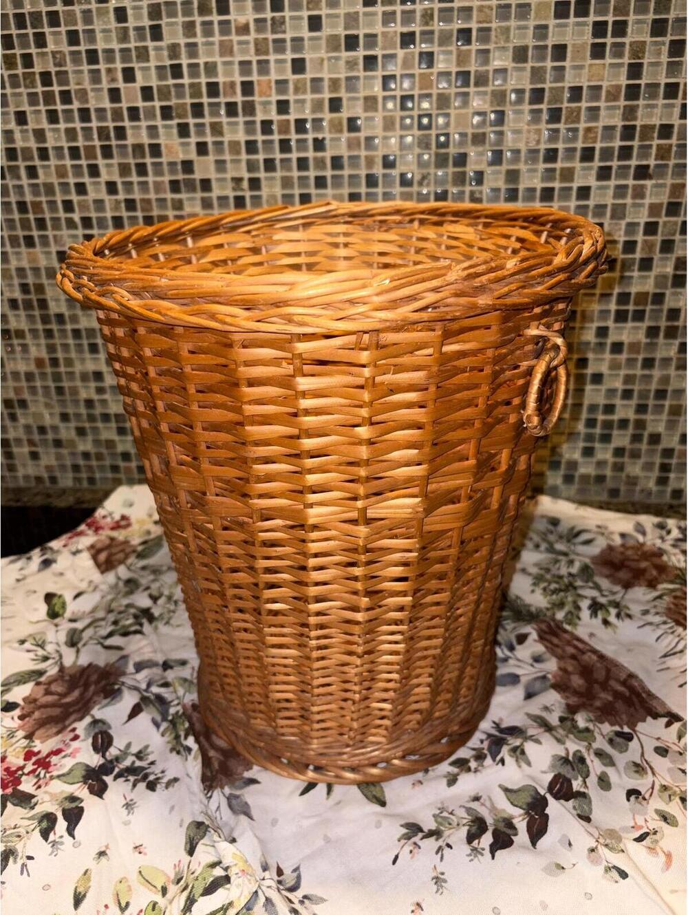 Wicker waste basket trash can.